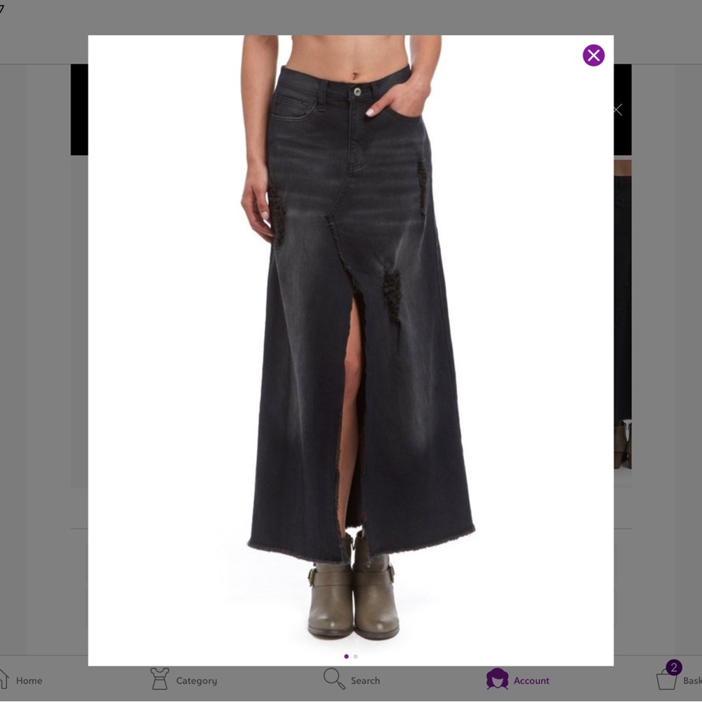 Distressed fit and flare long black denim skirt. Very edgy style.